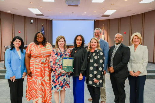 SBISD board of trustees presenting a plaque