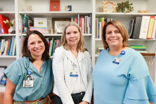 Melissa Ramirez, Rhoda Goldberg, and Stacey Weirich standing together, smiling