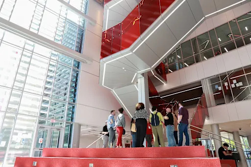 parents looking up at staircase inside new memorial high school addition