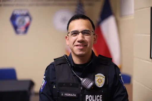 Officer Juan Pedraza smiling in uniform