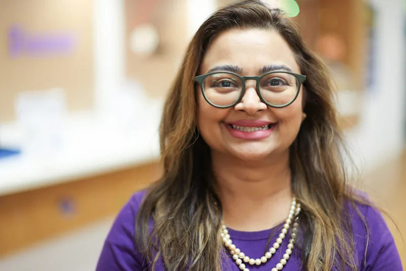 Asna Masood smiling