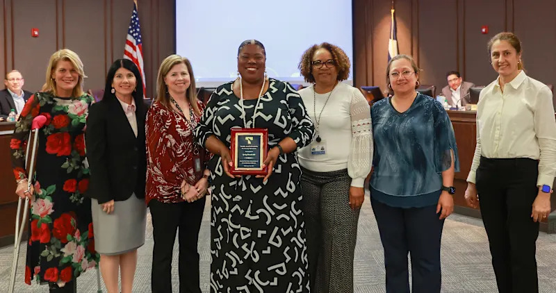 SBISD procurement services team accepting an award