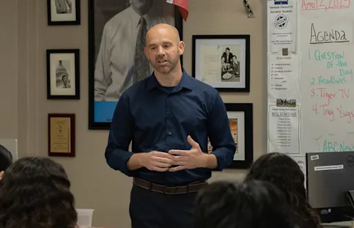 Joshua Ault teaching at a whiteboard