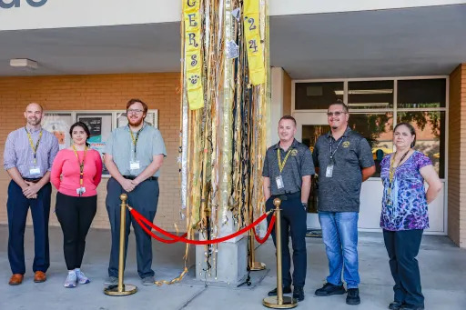 teachers standing in front of streamers