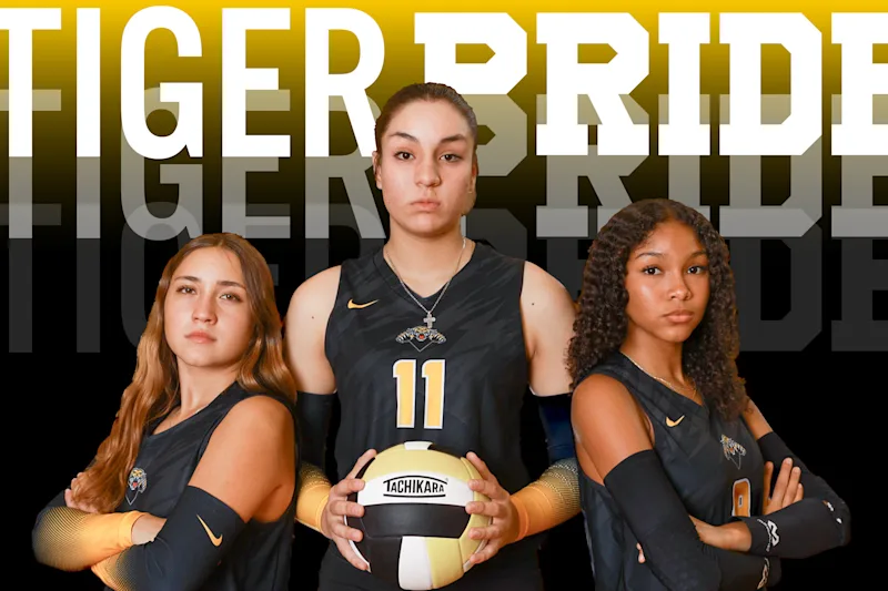 Spring Woods Women's Volleyball team standing in front of text reading "Tiger Pride"