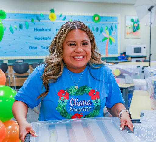 teacher holding a classroom kit box