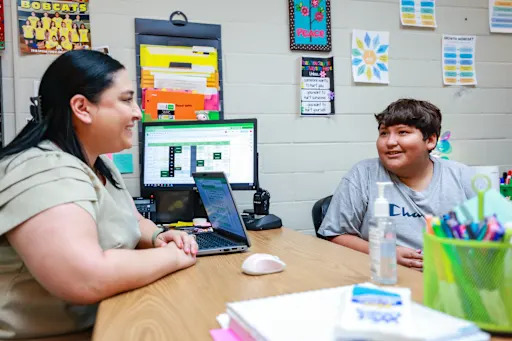 a school counseler speaking with a student