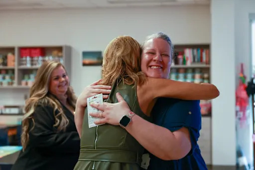 Kristina King hugging another person