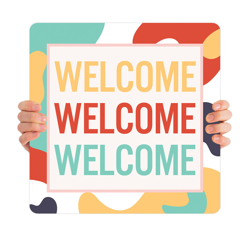 A square sign with a multi-colored abstract pattern, displaying the word "WELCOME" in red, yellow, and green.
