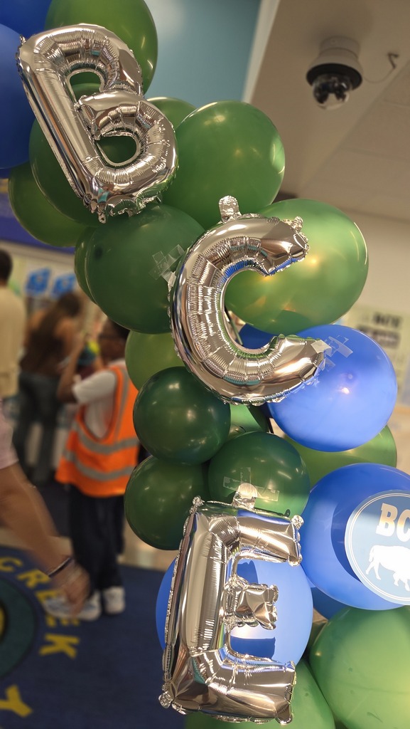 Photo of balloon arch displaying BCE in the front office.