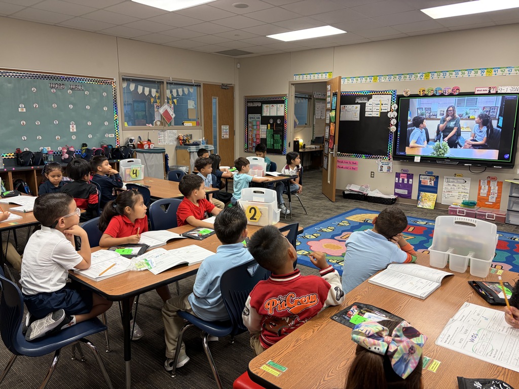 1st Graders watching the morning Buzz of the Hive announcements! 
