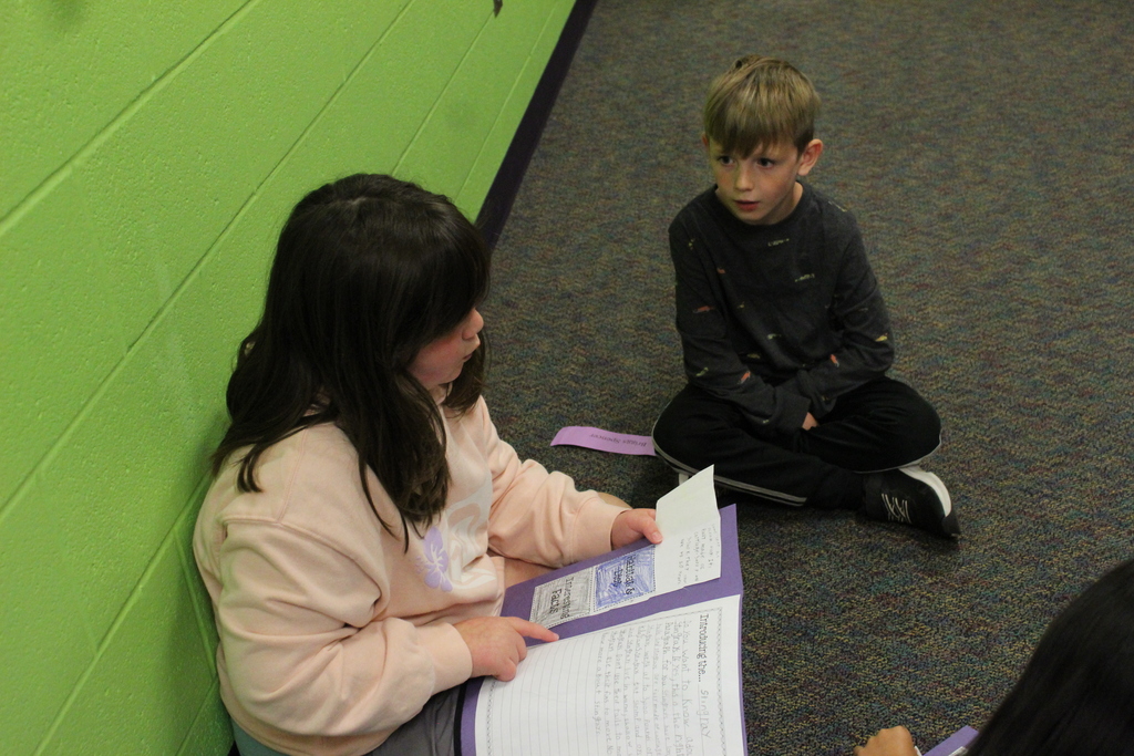 3rd Graders share their animal lapbooks with 1st Grade Buddies