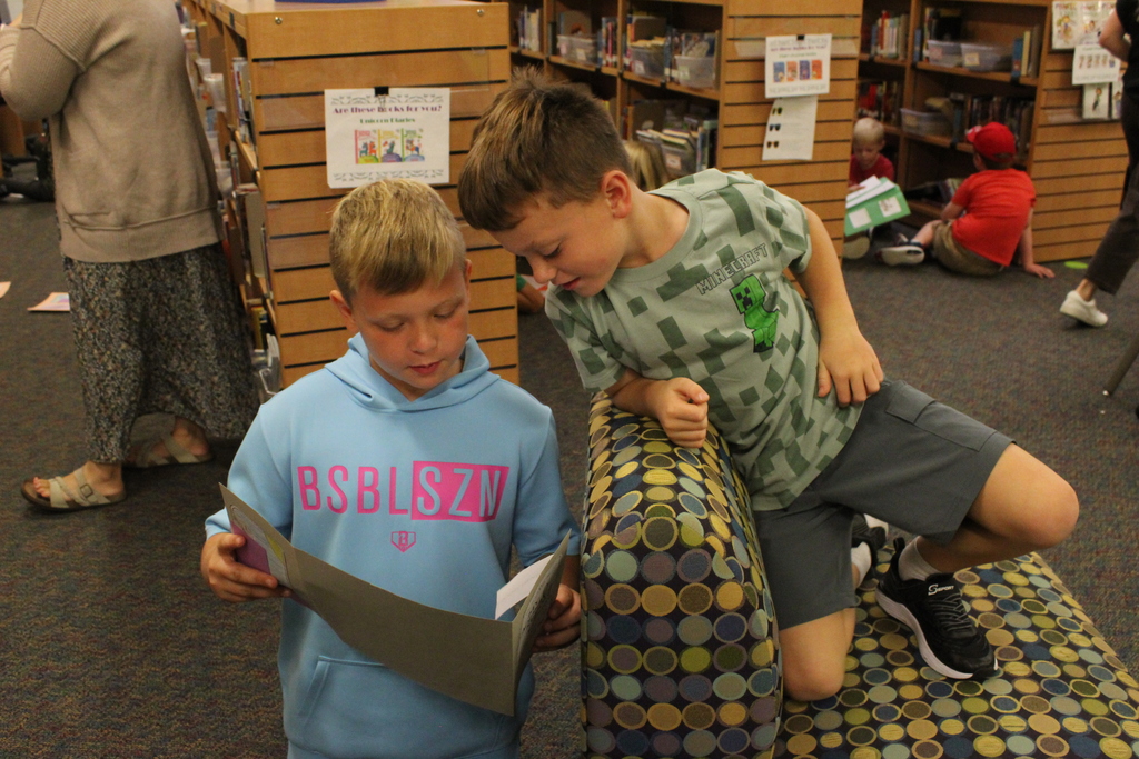 3rd Graders share their animal lapbooks with 1st Grade Buddies