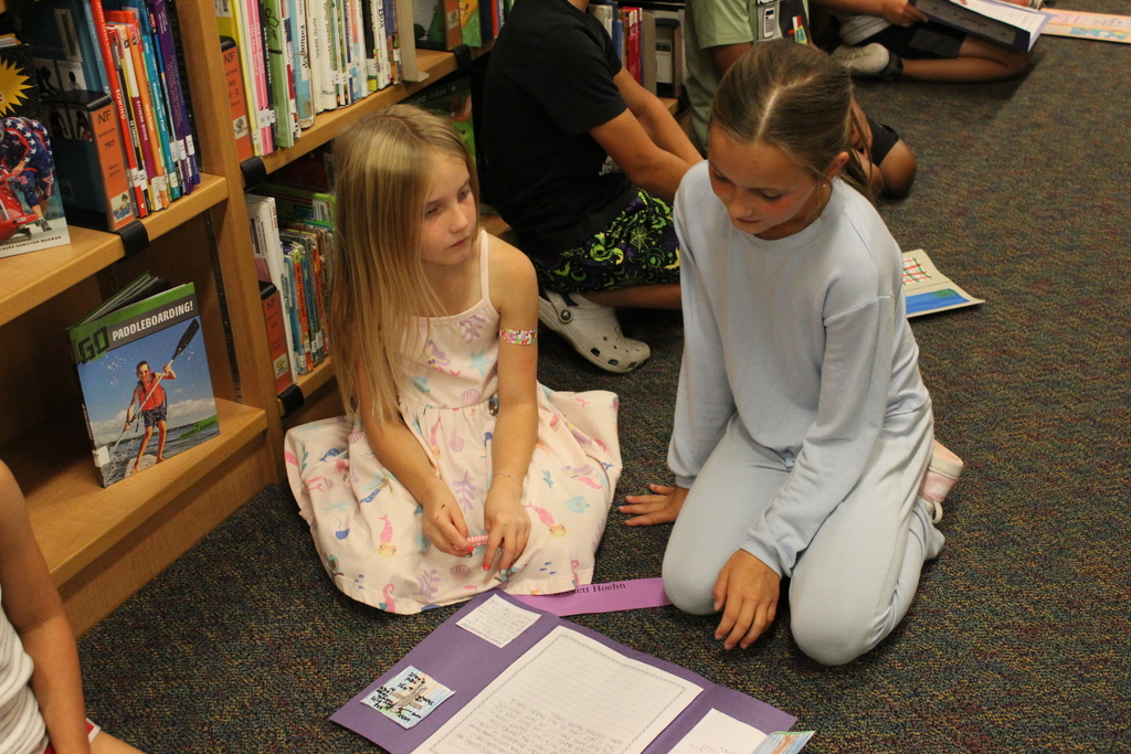 3rd Graders share their animal lapbooks with 1st Grade Buddies
