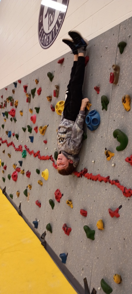 straight upside down on the climbing wall