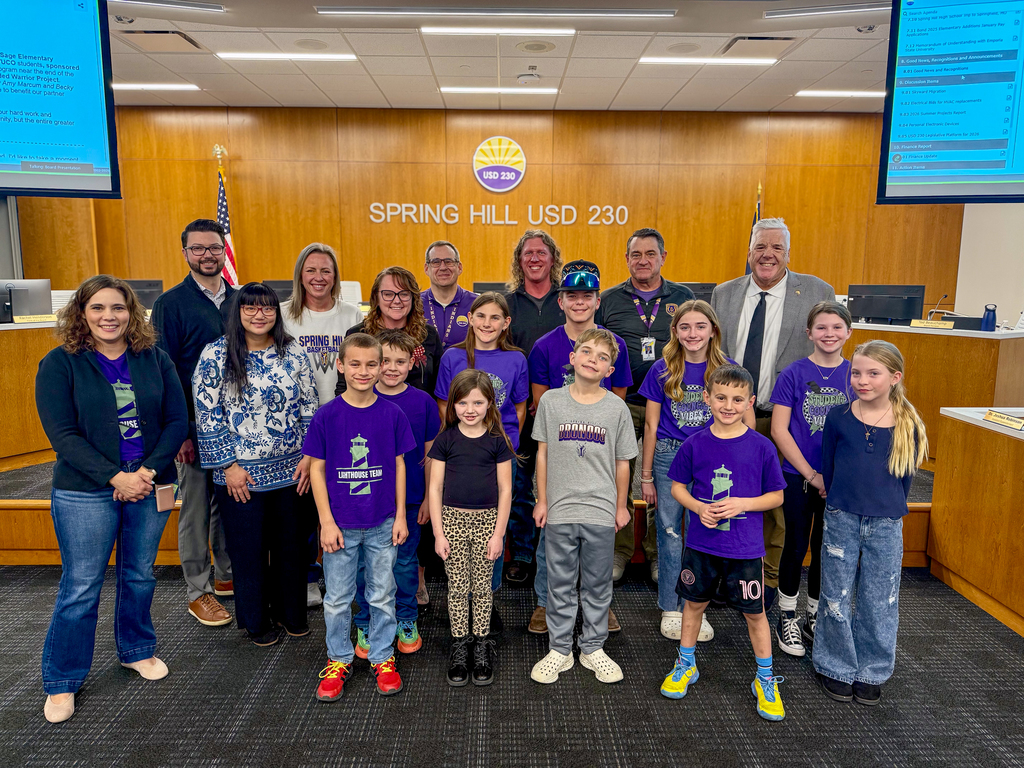 tStudents from Timber Sage Elementary School posing with members of the Board of Education at the February 9 meeting.
