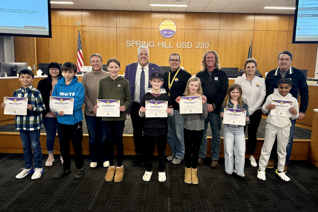 Members of the Board, Dr. Luttrell, and Spelling Bee champions