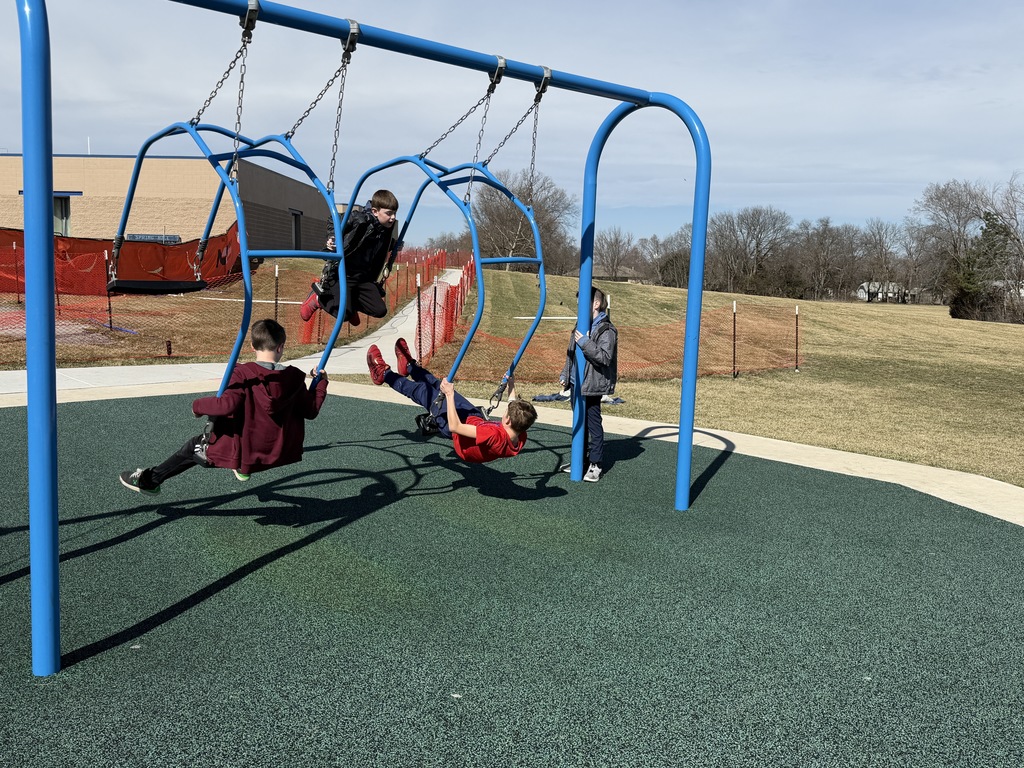 Fourth graders swinging