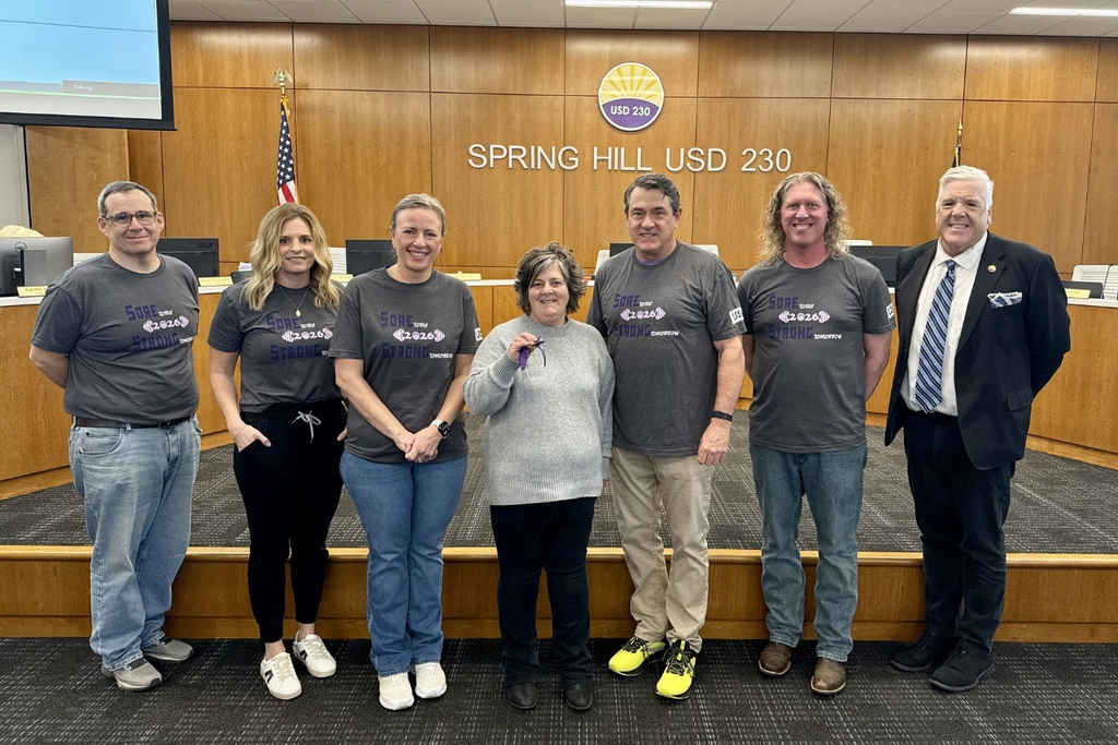 Elizabeth Moore posing alongside Superintendent Luttrell and Board of Education members Chitwood, Baker, Horne, Hull, and Beauchamp
