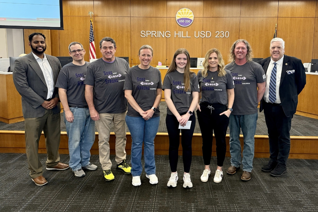High school senior Melanie Webber posing alongside HR Director Tyler, Superintendent Luttrell, and Board of Education members Chitwood, Hull, Horne, Baker, and Beauchamp
