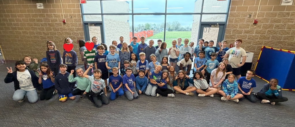 Fourth grade students wearing blue shirts.