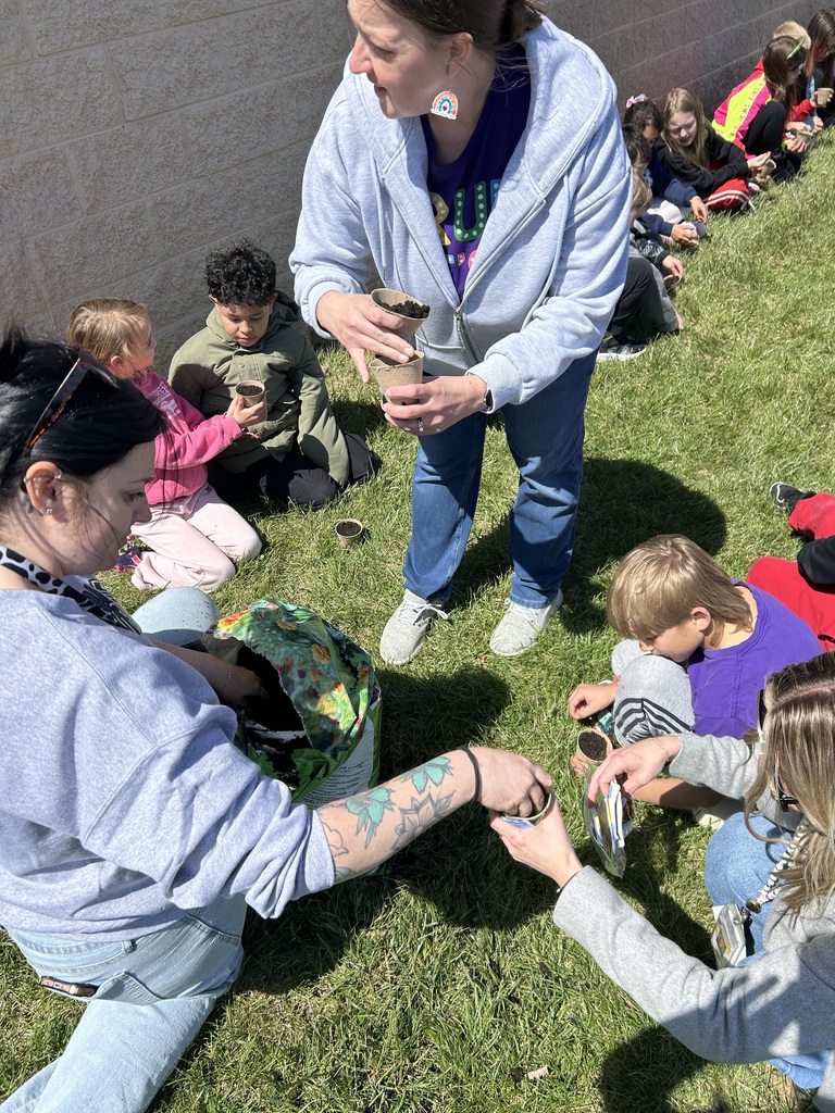 Third Grade planting flowers