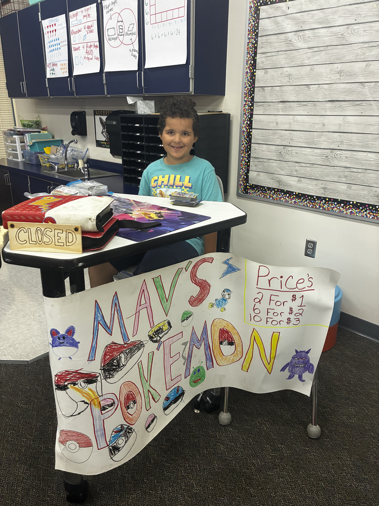 Student selling items at Market Day.