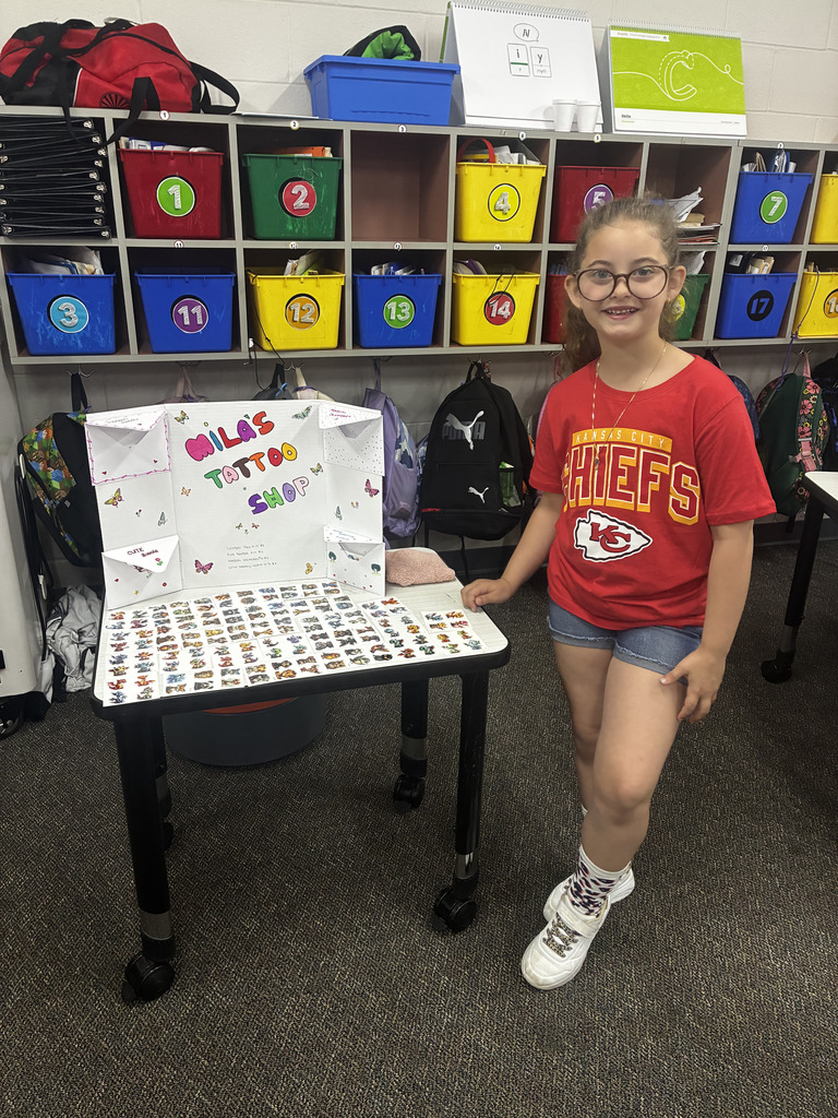 Student selling items at Market Day.