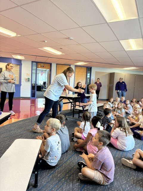 Hohendorf giving out a shirt.