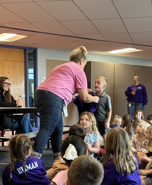 Heiman giving out a shirt.