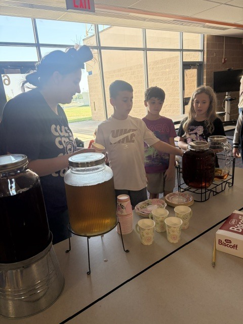 Serving tea to 3rd graders