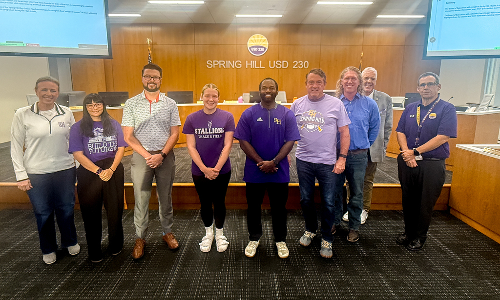 Members of the USD 230 Board of Education, along with Superintendent Luttrell, posed with Coach Reggie Harris and SHHS student Payton Knipp