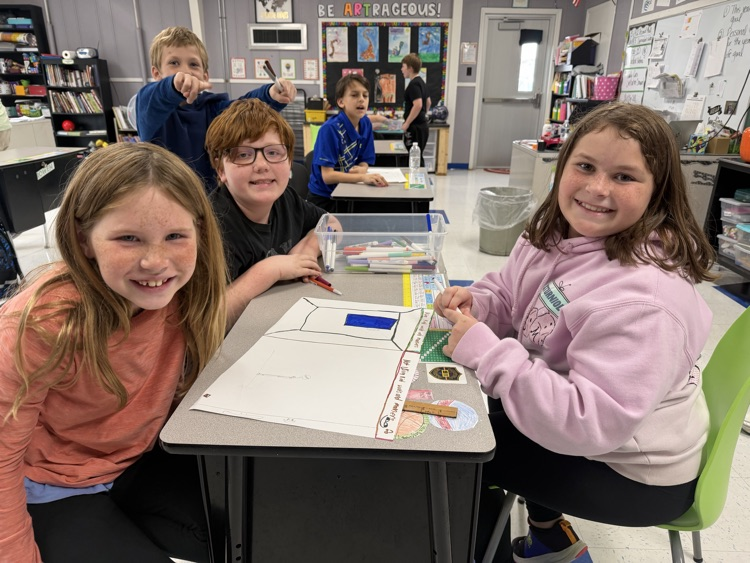 students working together on poster projects