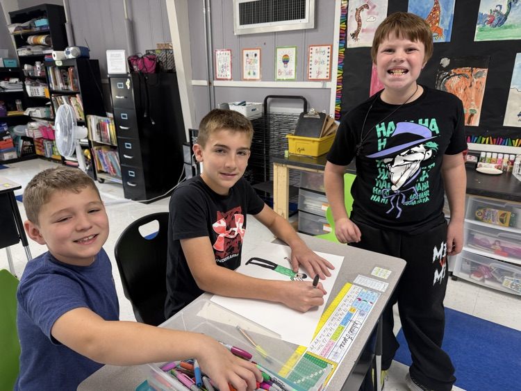 students working together on poster projects