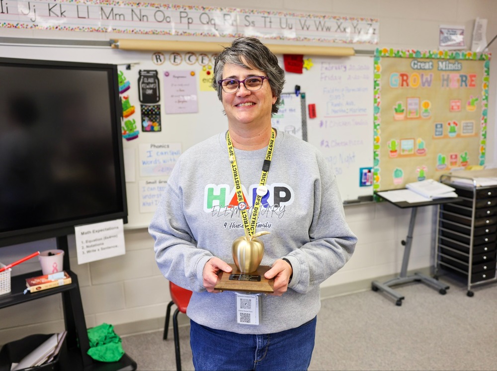 Harp Elementary teacher Vicki Matthews gets recognized by KNWA & FOX24 - Northwest Arkansas & River Valley News as the Golden Apple Winner for February! 🍎 Whether she’s in the classroom or leading the school’s drumline🥁, Vicki provides a unique outlet for our 3rd, 4th, and 5th-grade students to grow in both artistry and discipline. She isn't just following a lesson plan; she is building a legacy! Congratulations, Vicki, on your Golden Apple Award and the special recognition from Post Consumer Brands Post Cereals! 🍏✨ Check out the full story: https://app.smore.com/n/4c8jw #SpringdaleFamily #GoldenAppleAward  #PostCereals #KNWA