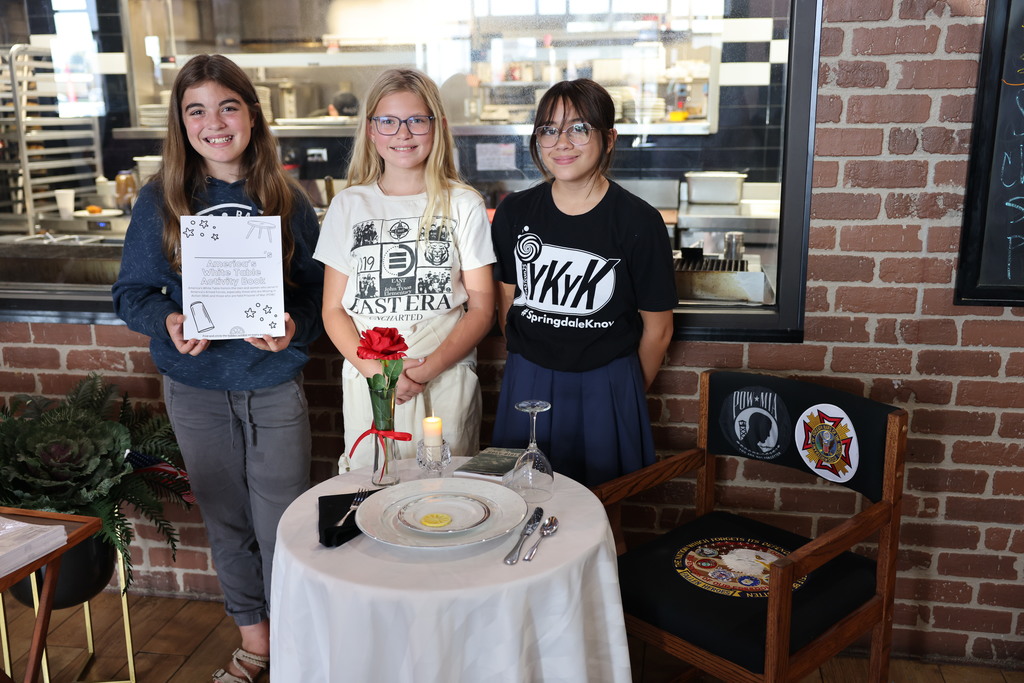 A powerful and meaningful message from some incredible students!  Aubrey, Avery, and Kaylee from John Tyson Elementary School of Innovation shared their moving activity book, "America's White Table," with members of the VFW Post 2952 Auxiliary today.  They honored the men and women of our armed forces who are missing in action or held as prisoners of war as part of POW/MIA Remembrance Day. The "white table" is a powerful symbol of their sacrifice.  It's inspiring to see these young students learning about and honoring such an important part of our nation's history. Thank you, Aubrey, Avery, and Kaylee, for sharing your project!  #POWMIA #RemembranceDay
