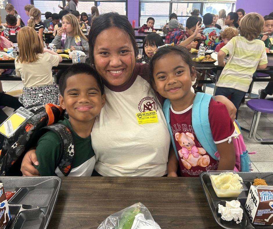 Walker families having dinner with their kids with the ROAR program