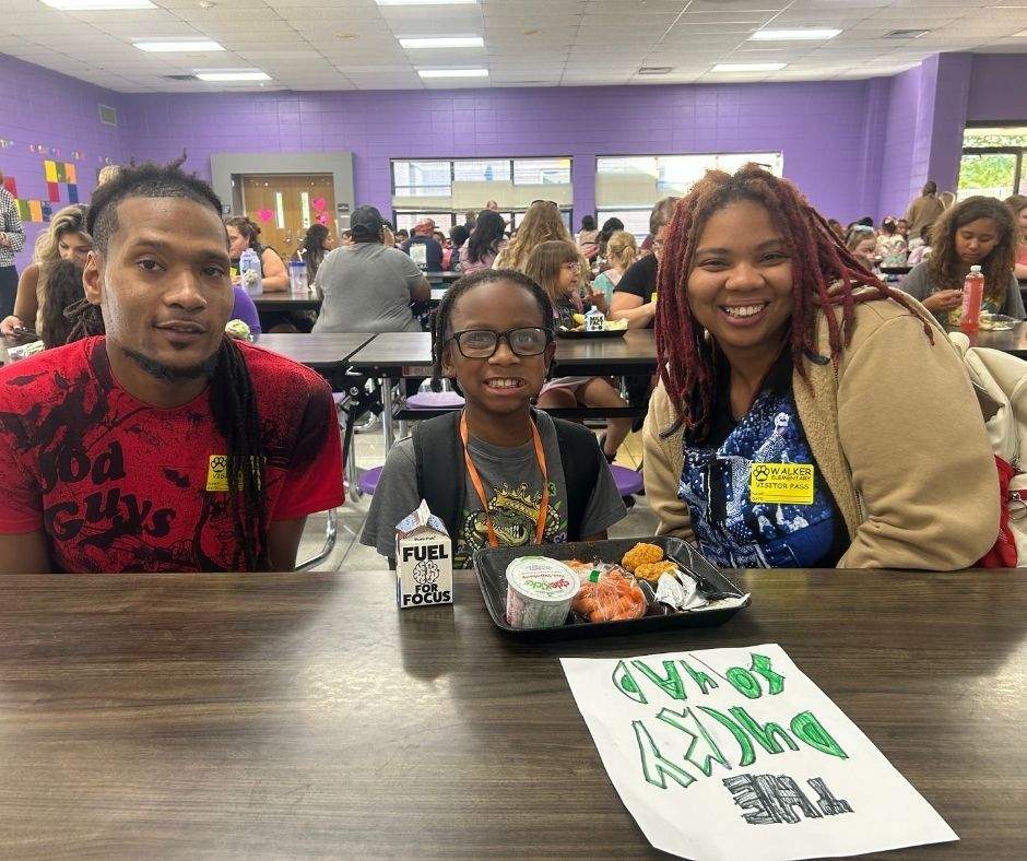 Walker families having dinner with their kids with the ROAR program