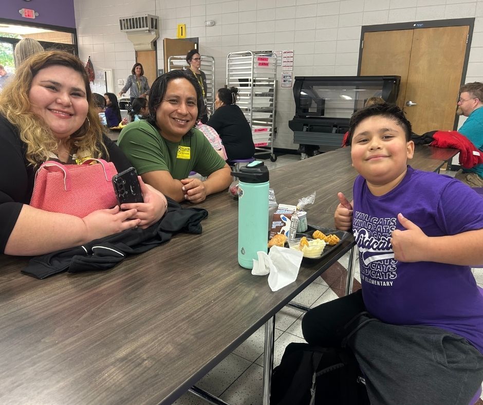 Walker families having dinner with their kids with the ROAR program