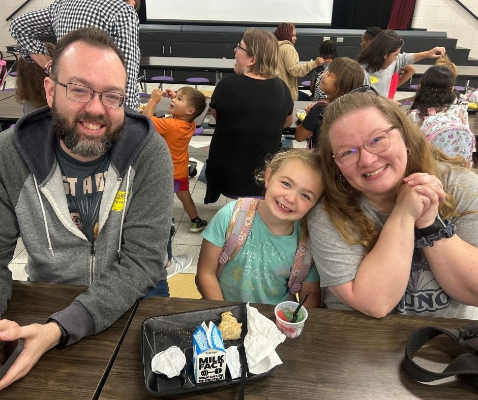 Walker families having dinner with their kids with the ROAR program