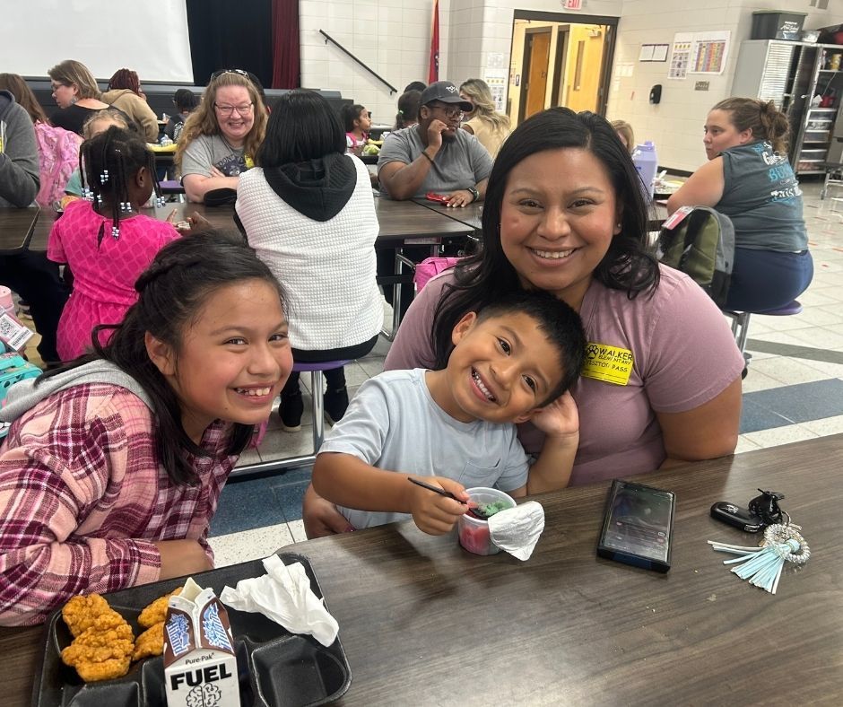 Walker families having dinner with their kids with the ROAR program