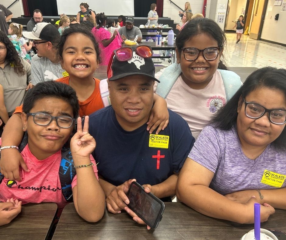 Walker families having dinner with their kids with the ROAR program