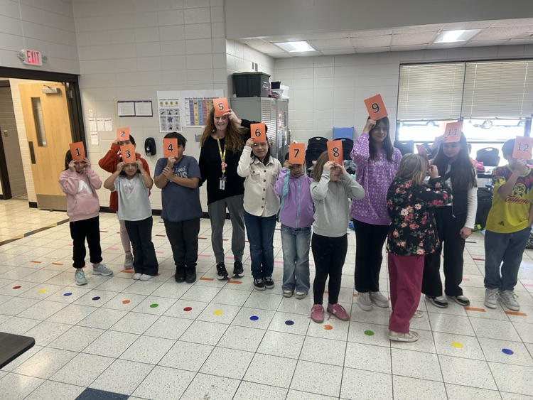 Students playing a number game