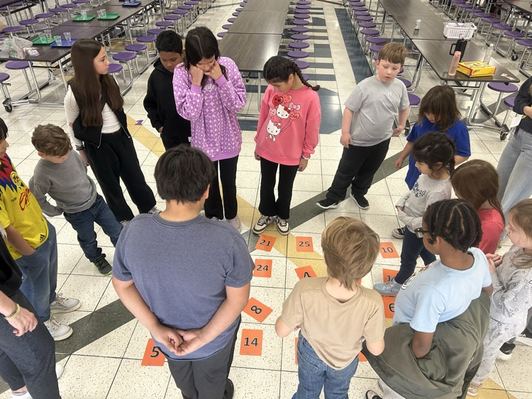 Students playing a number game
