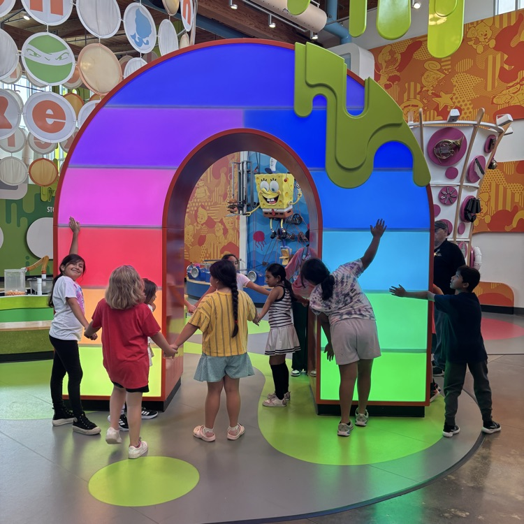 Students playing in the sound exhibit at the Amazeum
