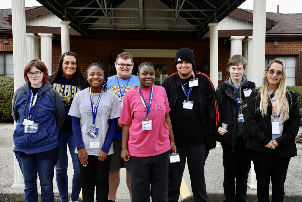 SHS Transition students and staff stand in front of Villa Springfield