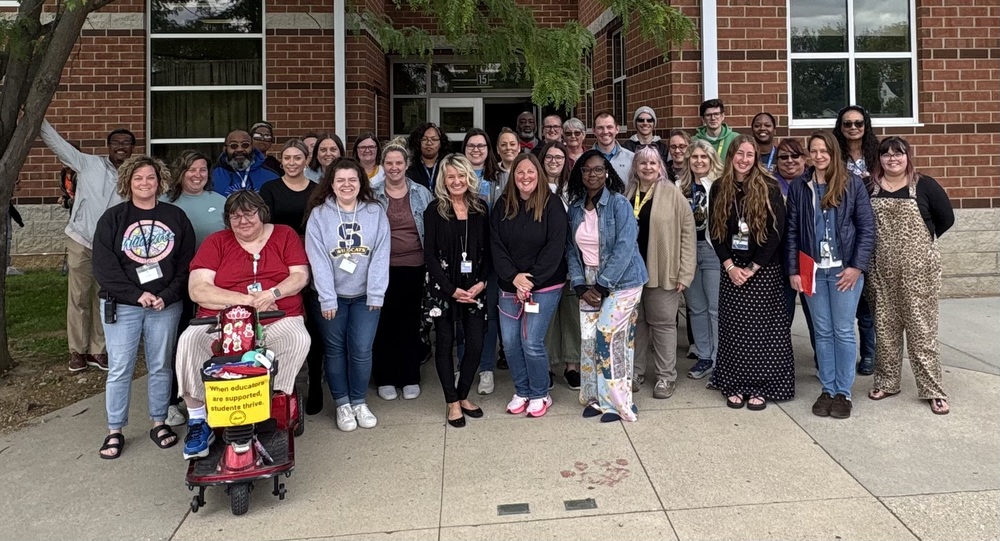 Lagonda Elementary's staff pose for a picture outside their building