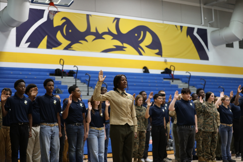 The MJROTC cadets raise their right hands