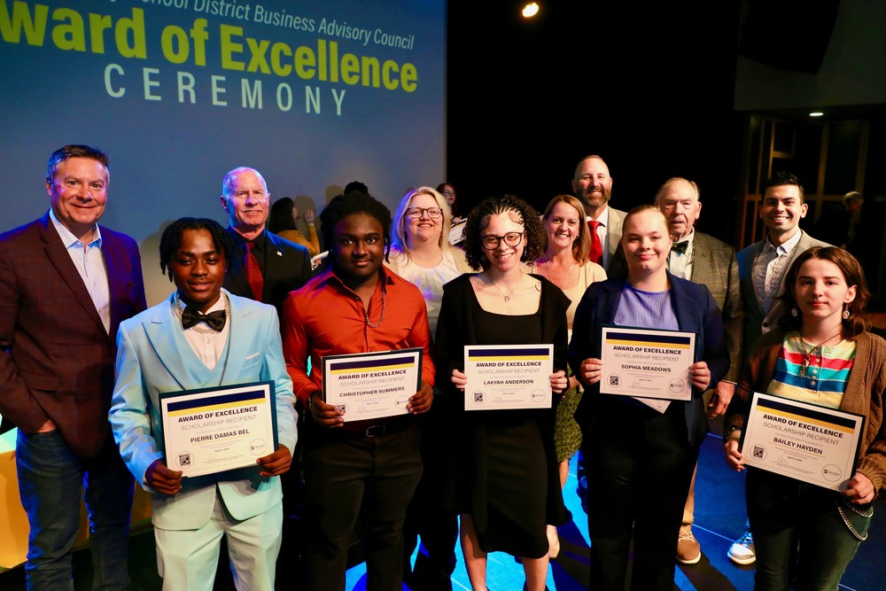 Scholarship winners pose with members of the Business Advisory Council