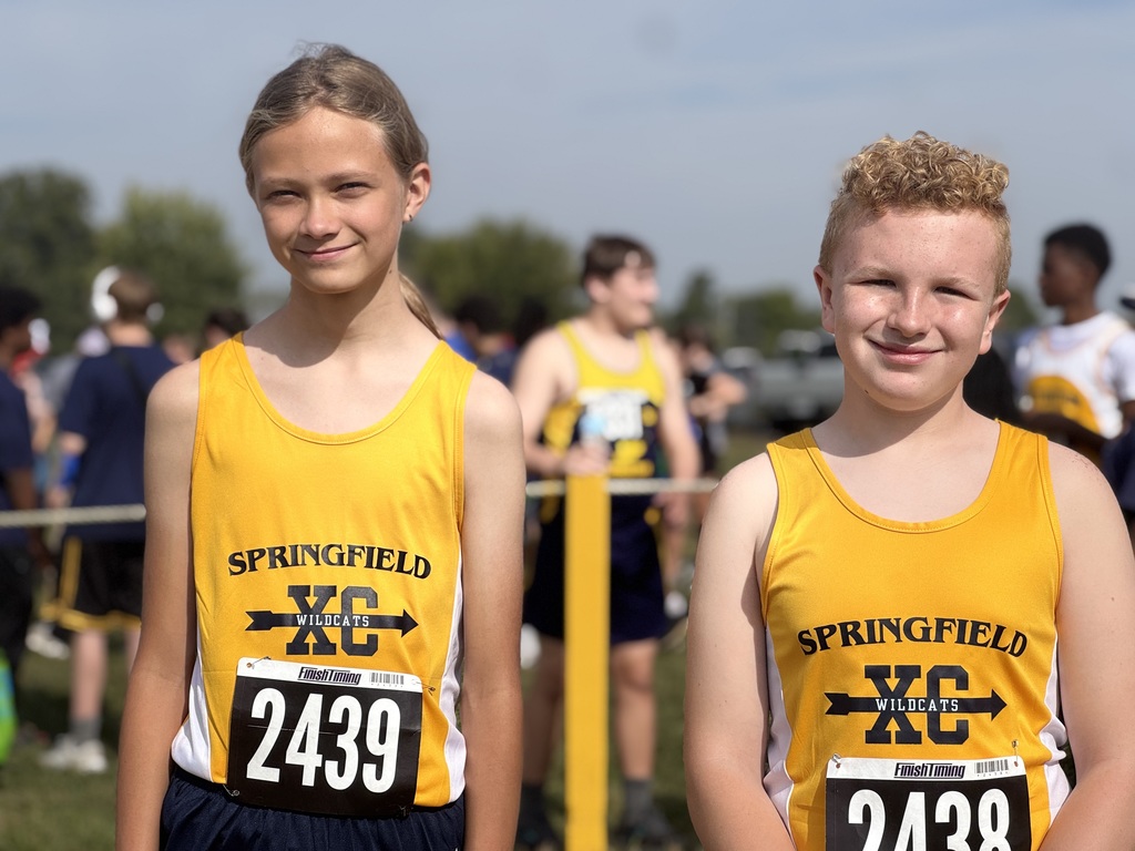 Two runners in yellow uniform